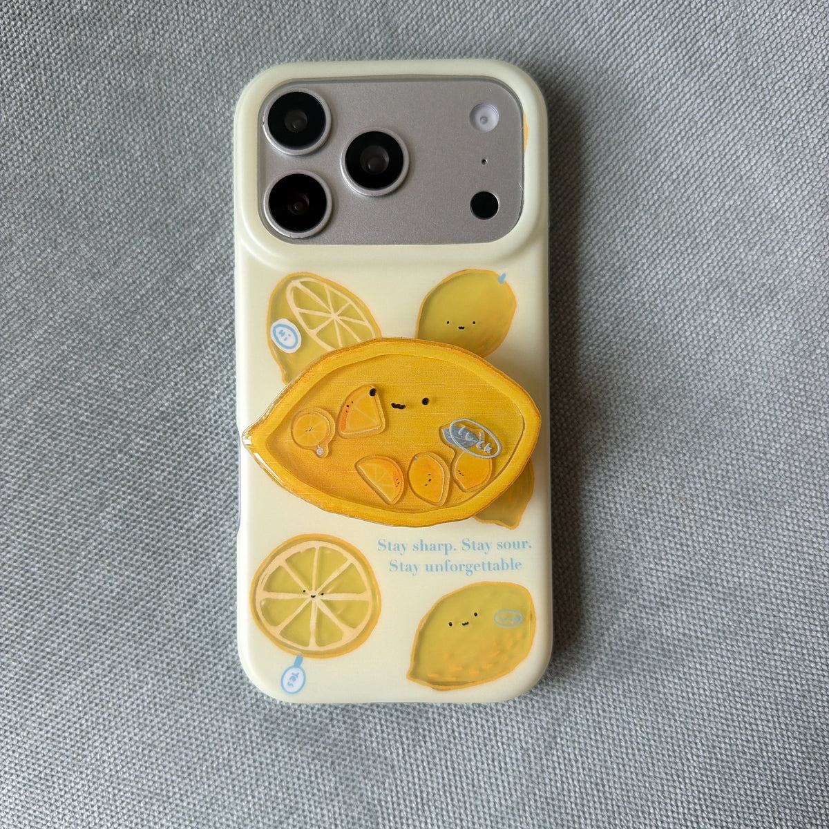 レモン柄 ニコちゃんレモン グリップ付き iPhoneケース｜淡色イエロー・ゆるかわ #261275